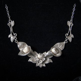 Sterling silver necklace inspired by nature with human teeth